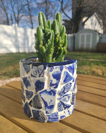 White broken china mosaic planter with intricate mosaic pattern, suitable for indoor or outdoor plant display.