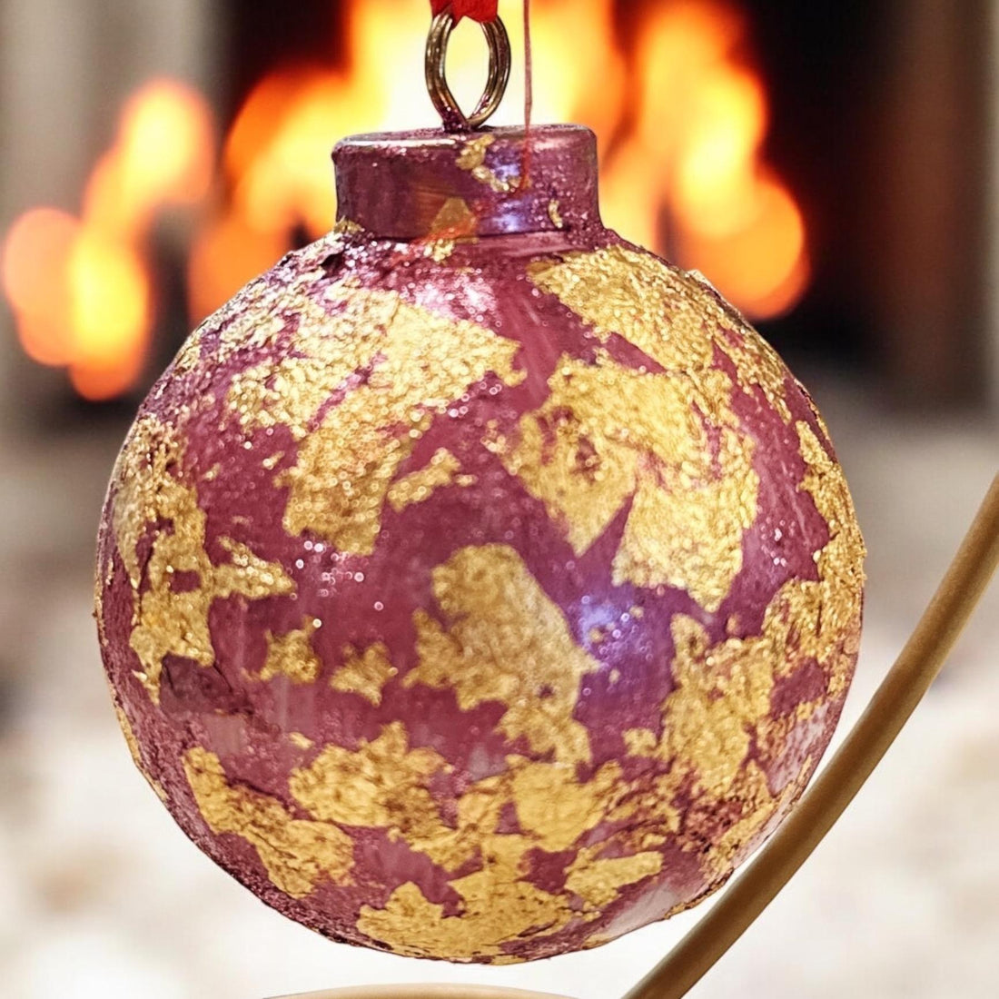 Rose and gold leaf Christmas ornament with intricate detailing, ideal for holiday decorating.