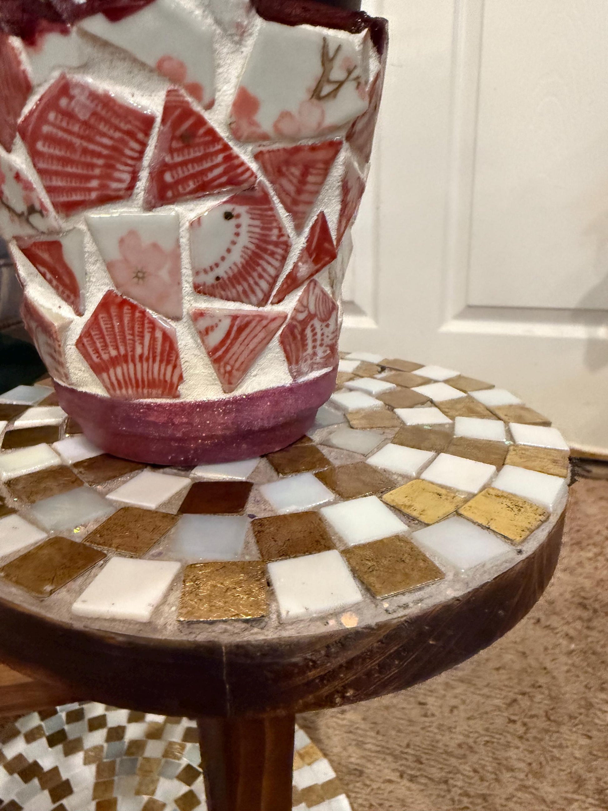 Handcrafted 3-tier mosaic plant stand with colorful tiled surfaces, ideal for displaying potted plants indoors or outdoors
