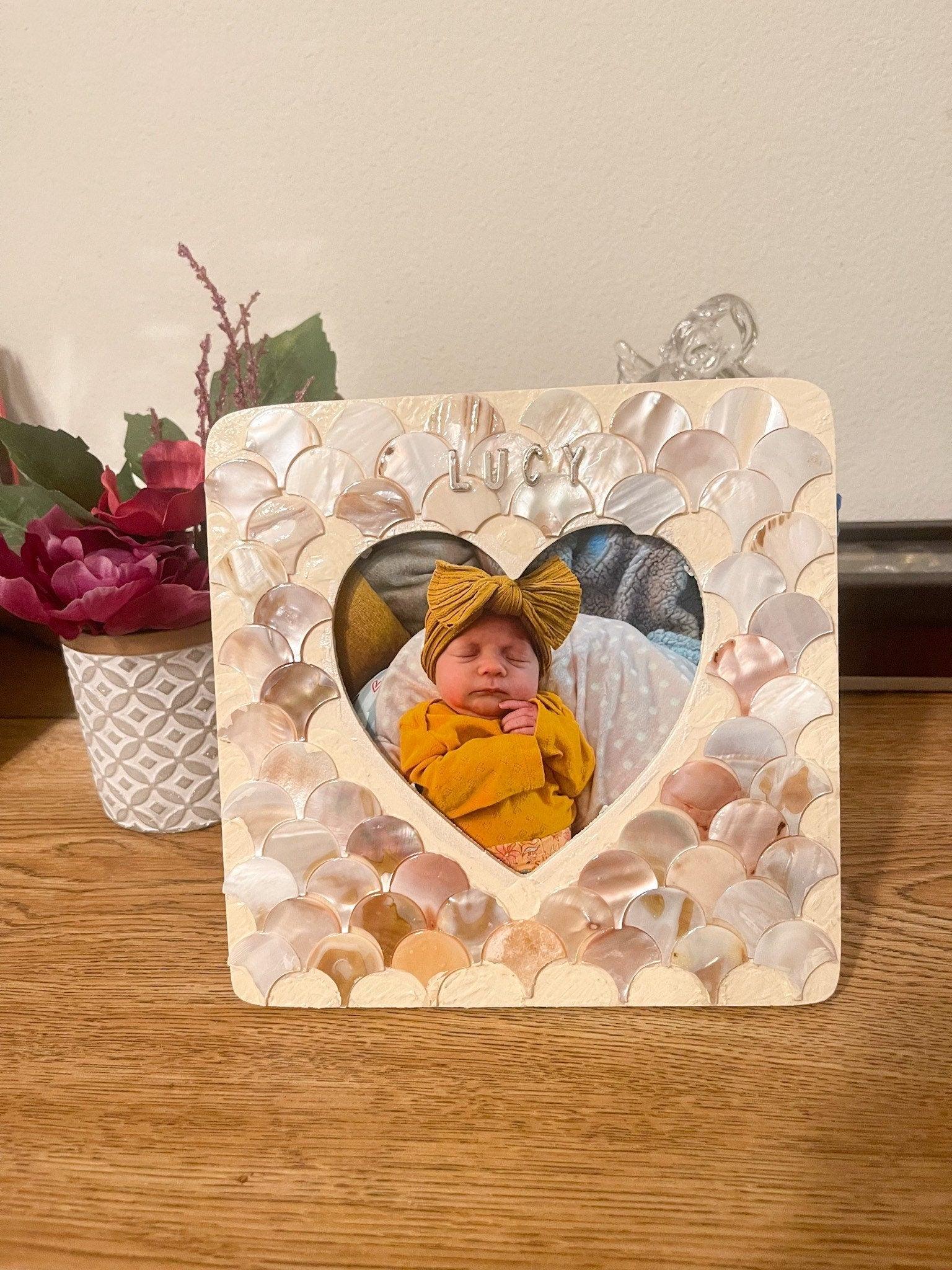 Mother of Pearl personalized photo frame with engraved design, showcasing elegant craftsmanship and a polished finish.