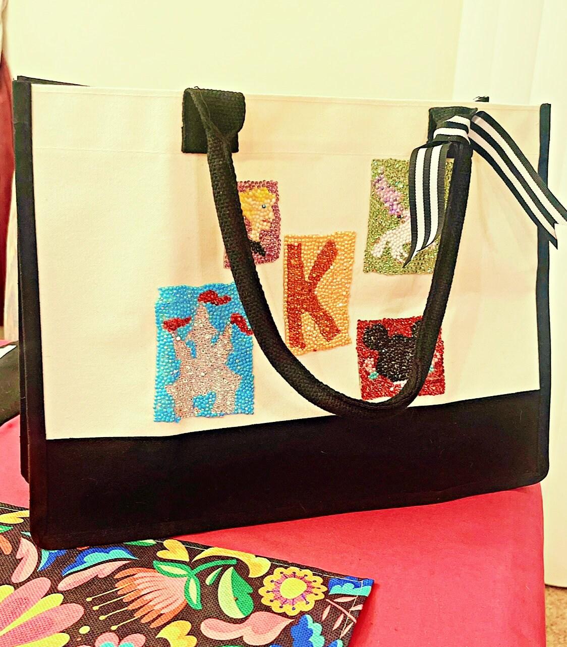 Handmade "K" initial diamond art tote bag featuring fairy tale design and sparkling diamond accents.
