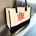 Hand-painted abstract floral canvas tote bag with colorful floral designs on a sturdy fabric background.