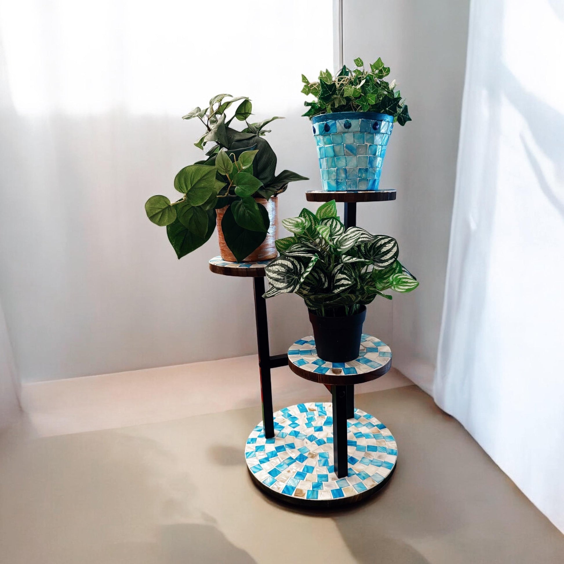 Three-tier azure mosaic metal plant stand with decorative design, perfect for displaying potted plants indoors or outdoors.
