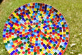 Colorful rainbow mosaic decorative wall plate with intricate patterns, designed for wall display and home decor.