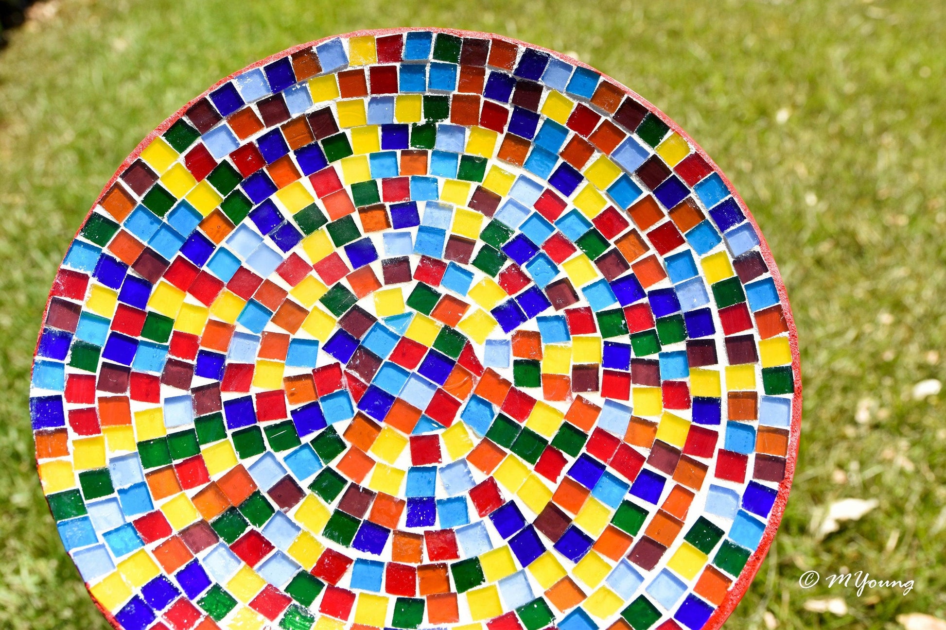 Colorful rainbow mosaic decorative wall plate with intricate patterns, designed for wall display and home decor.