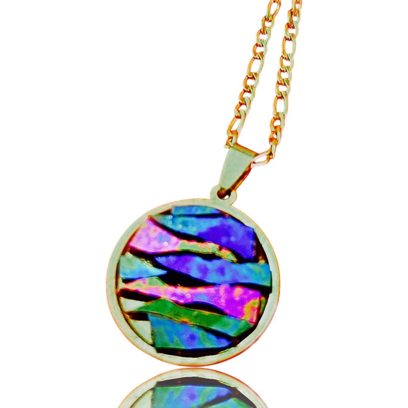 Colorful pendant necklace with vibrant beads and silver chain, stylish jewelry accessory.