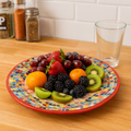 Colorful handcrafted mosaic fruit bowl with vibrant patterns, showcasing a unique artisan design and bright ceramic finish.