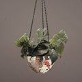 Hanging disco ball planter by Miss Bette's Creations with artificial pink carnations for decorative indoor or outdoor display.