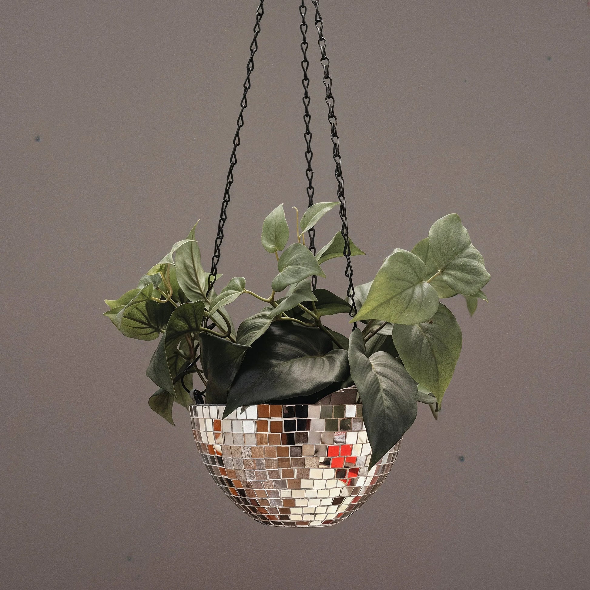 Hanging disco ball planter by Miss Bette's Creations with artificial pink carnations for decorative indoor or outdoor display.