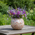 Handcrafted scalloped capiz-style mosaic bowl with iridescent shell design, showcasing intricate craftsmanship and shimmering surface.