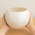 Artisan mother of pearl scalloped globe planter with intricate shell design, perfect for indoor or outdoor decorative plants.