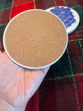 Blue marble mosaic coaster with artisanal design, showcasing intricate patterns and natural stone textures for decorative use.