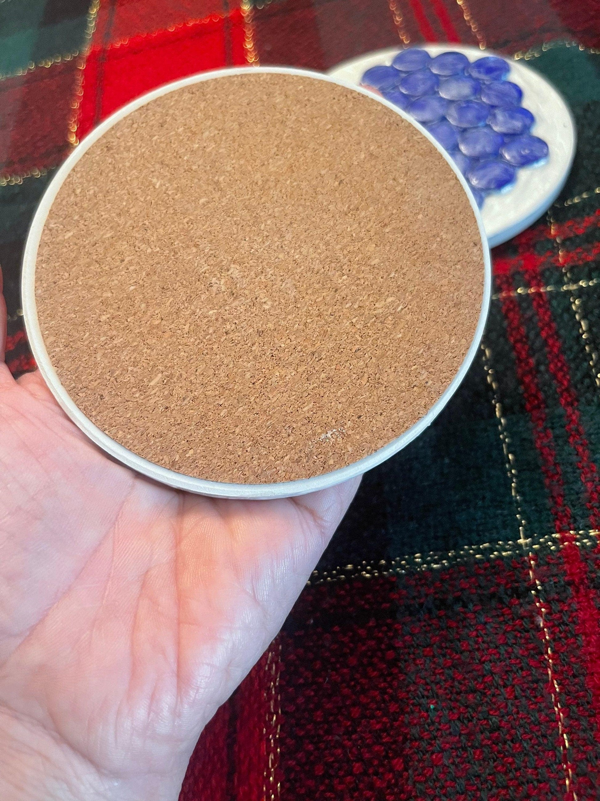 Blue marble mosaic coaster with artisanal design, showcasing intricate patterns and natural stone textures for decorative use.