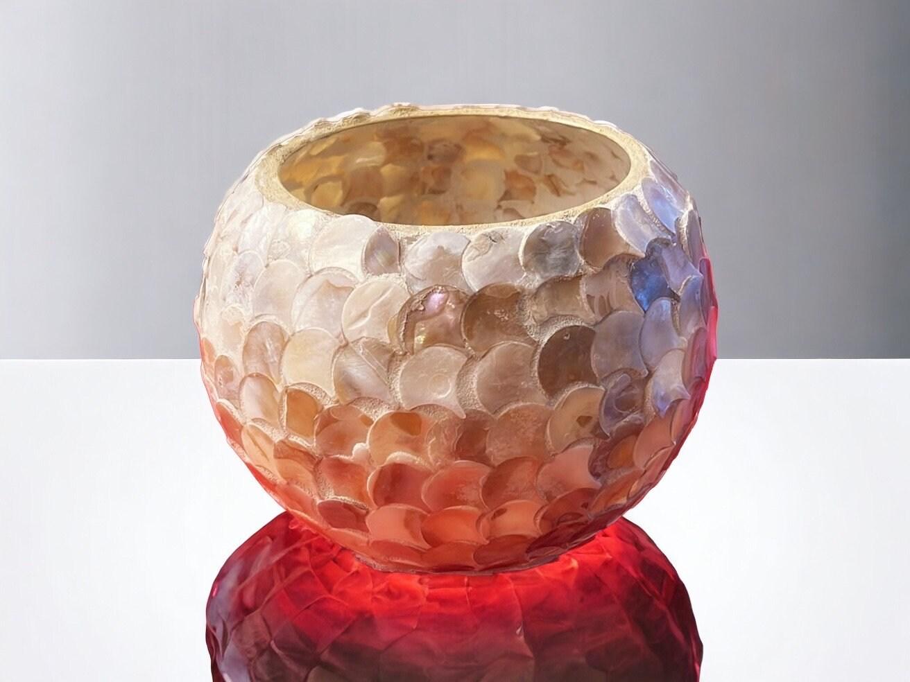 Handcrafted scalloped Capiz shell globe vase with intricate design, showcasing its elegant, translucent shell pattern.