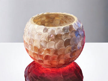 Handcrafted scalloped Capiz shell globe vase with intricate design, showcasing its elegant, translucent shell pattern.