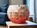 Handcrafted scalloped Capiz shell globe vase with intricate design, showcasing a delicate, translucent shell pattern.