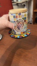 Artisan handcrafted mosaic glass jar with bamboo lid, decorative storage container showcasing colorful glass mosaic design.