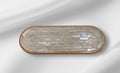 Rose quartz and slate mandala mosaic wall art featuring intricate geometric patterns on a decorative wall piece.