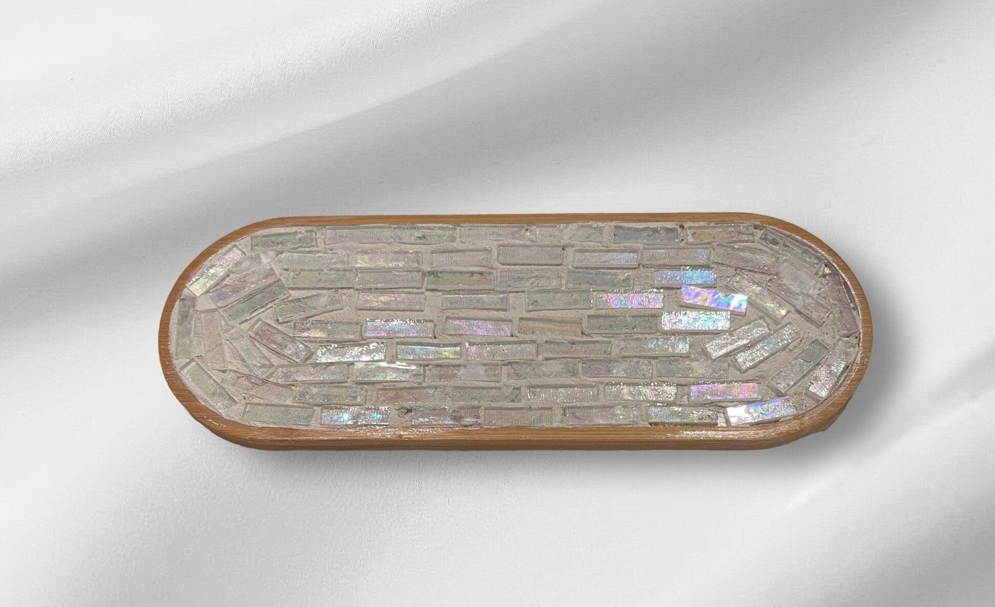 Rose quartz and slate mandala mosaic wall art featuring intricate geometric patterns on a decorative wall piece.