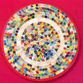 Colorful handcrafted mosaic fruit bowl with vibrant patterns, perfect for serving and decorative display.
