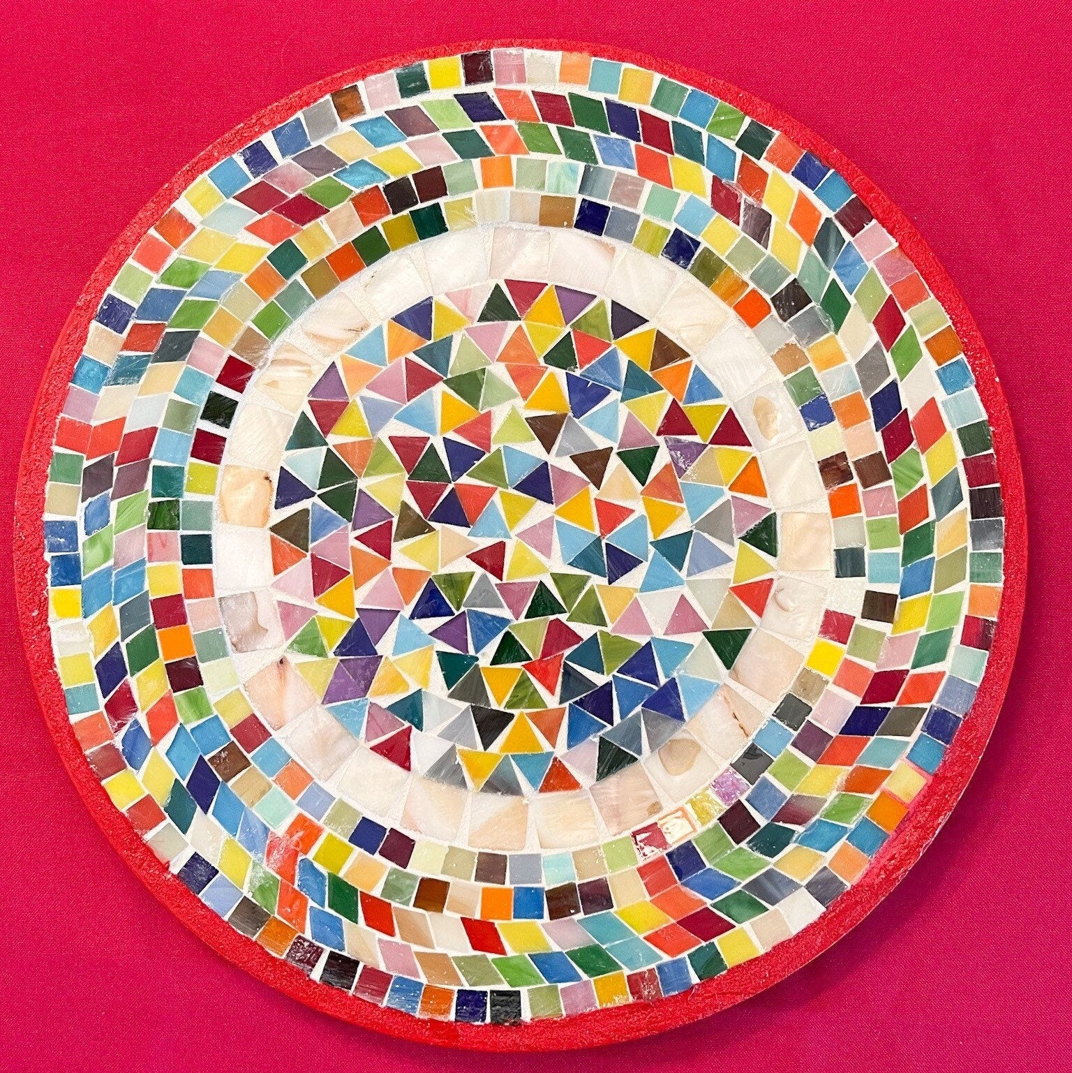 Colorful handcrafted mosaic fruit bowl with vibrant patterns, perfect for serving and decorative display.