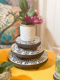 Handcrafted 4-tier mosaic plant stand set with colorful tiled shelves for indoor or outdoor display.