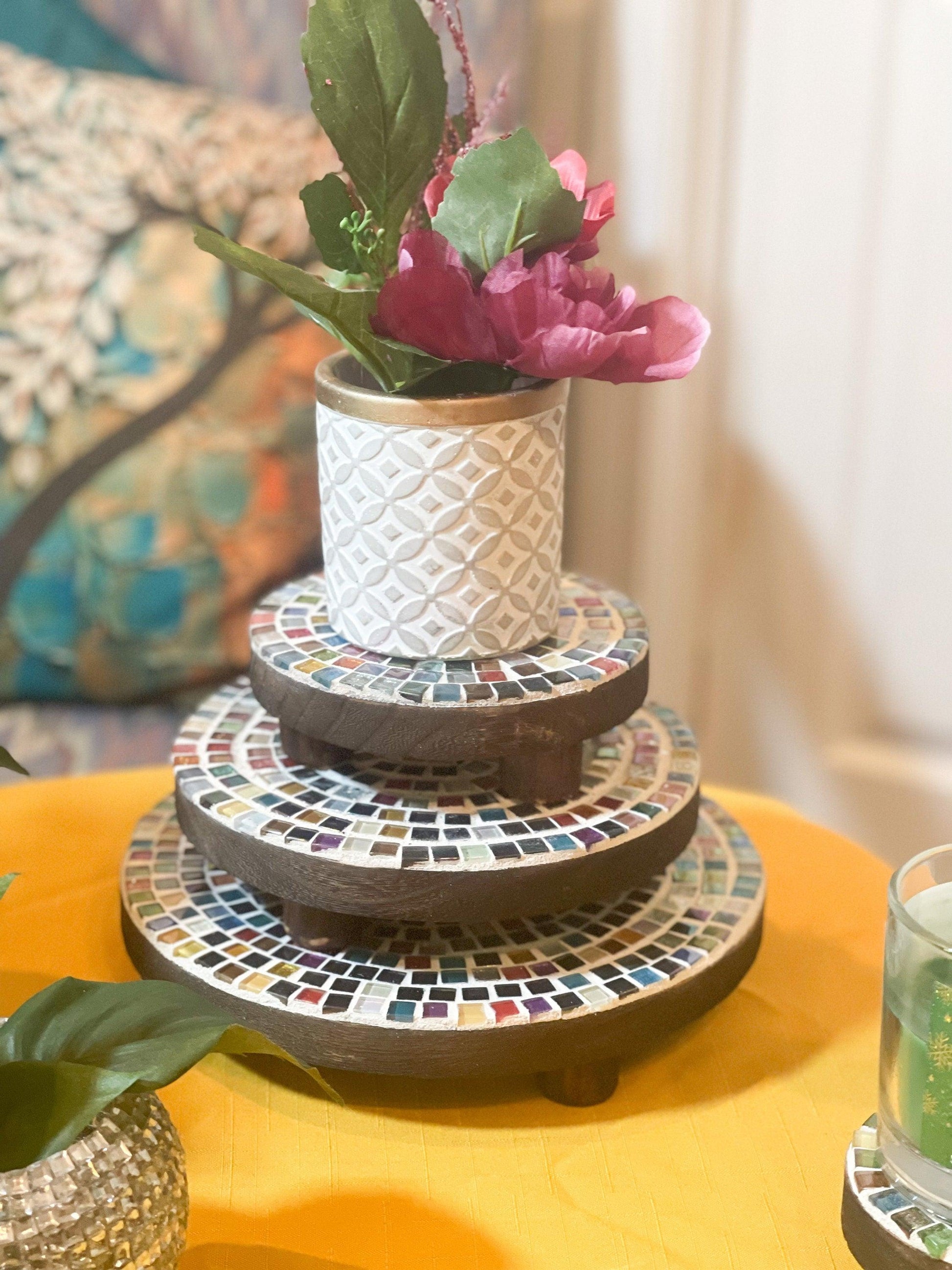 Handcrafted 4-tier mosaic plant stand set with colorful tiled shelves for indoor or outdoor display.