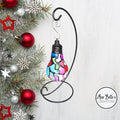Handmade stained glass light bulb with mosaic design, holiday ornament featuring colorful, intricate glass patterns.