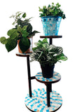 Three-tier azure mosaic plant stand with decorative ceramic shelves and metal frame, perfect for displaying potted plants indoors.