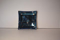Handcrafted mosaic mirror glass dish with colorful geometric patterns, showcasing intricate design and reflective surface.