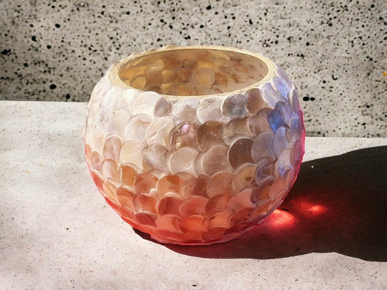 Handcrafted scalloped Capiz-style mosaic bowl with iridescent shell pieces, showcasing intricate design and shimmering surface.