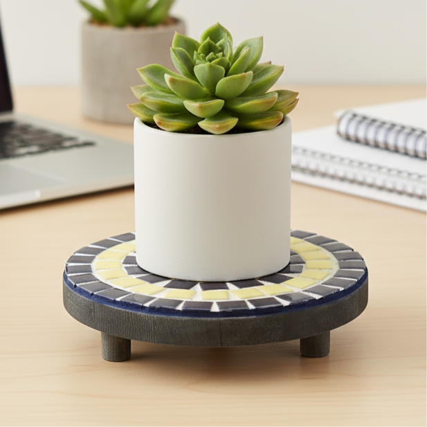 Handmade cobalt blue and yellow mosaic plant stand with intricate tile design, perfect for indoor or outdoor decor.