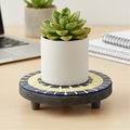 Handmade cobalt blue and yellow mosaic plant stand with intricate tile design, perfect for indoor or outdoor plants.