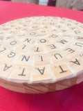 Decorative plant stand with a word game-themed design, perfect for showcasing potted plants in a modern, stylish interior.