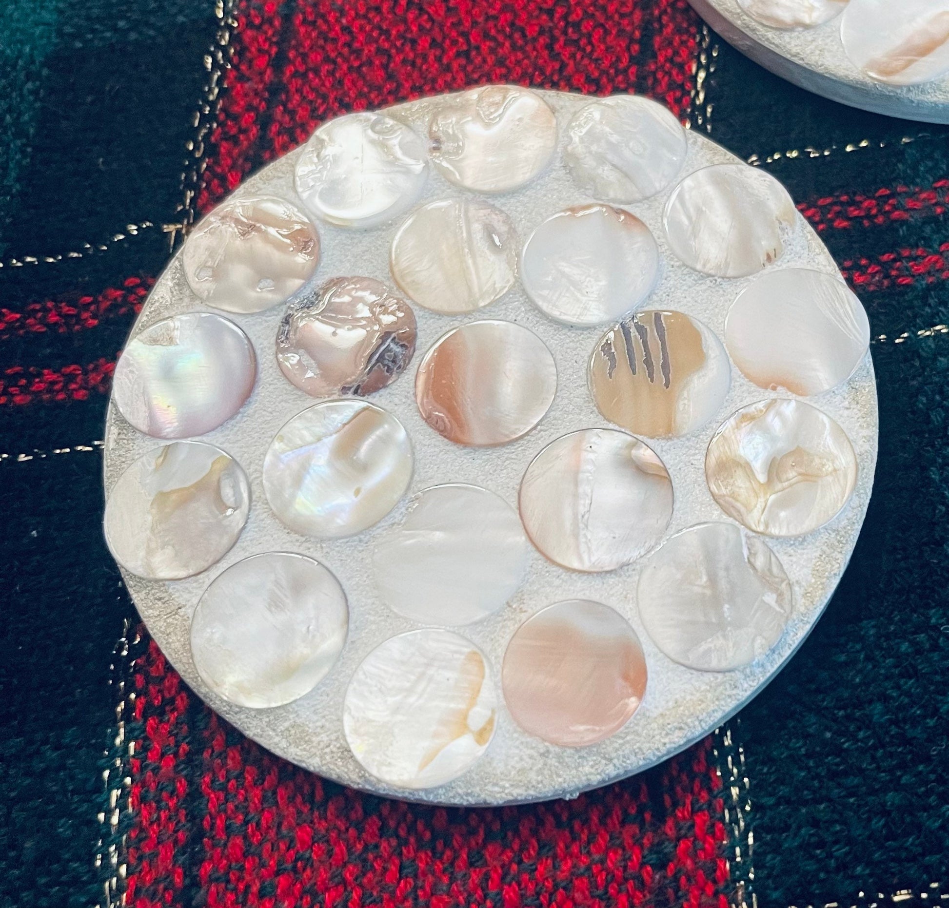 Handcrafted mother of pearl mosaic planter with intricate design, featuring a ceramic container decorated with shimmering shell pieces.