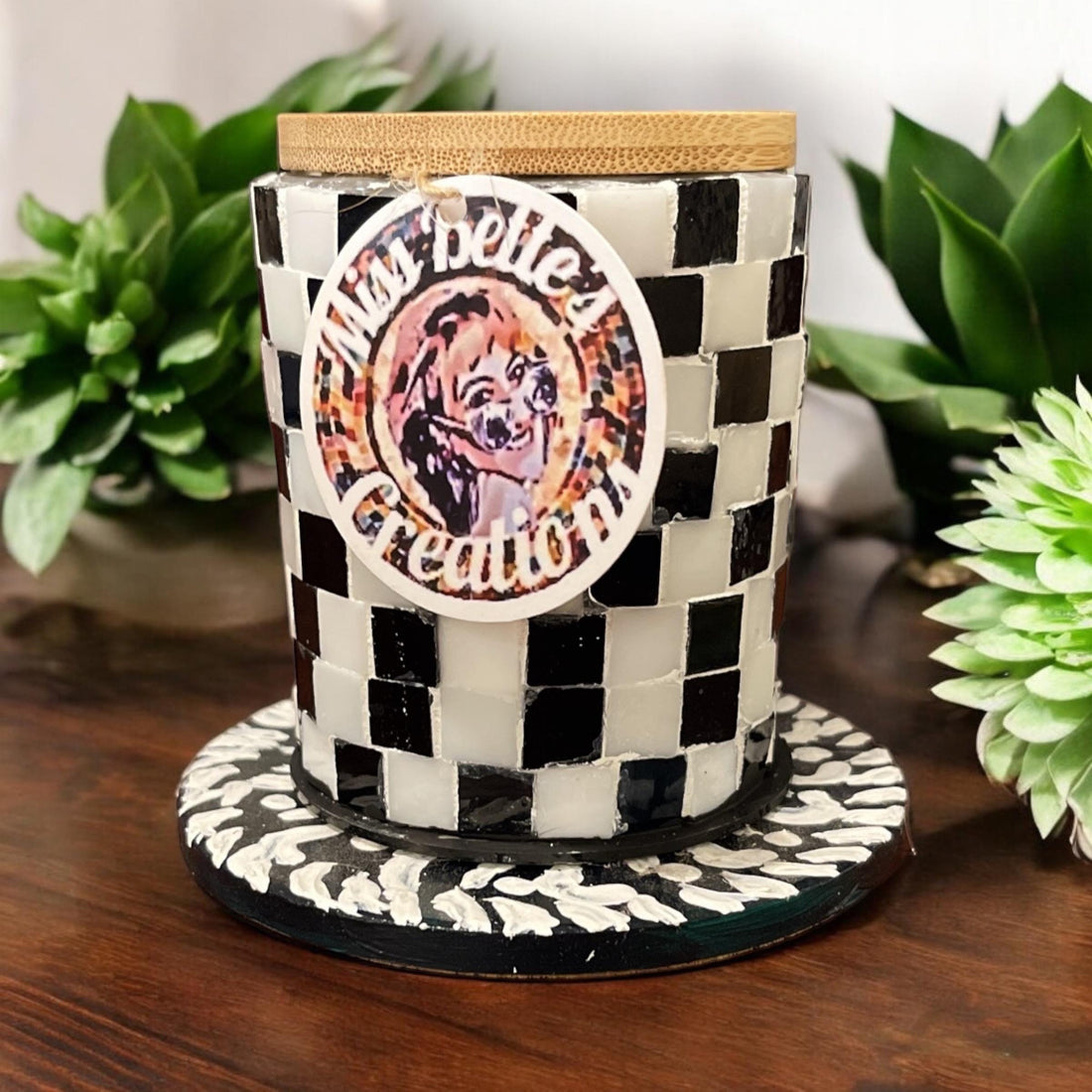 Handcrafted black and white checkerboard mosaic jar with intricate pattern, showcasing artistic craftsmanship and decorative design.