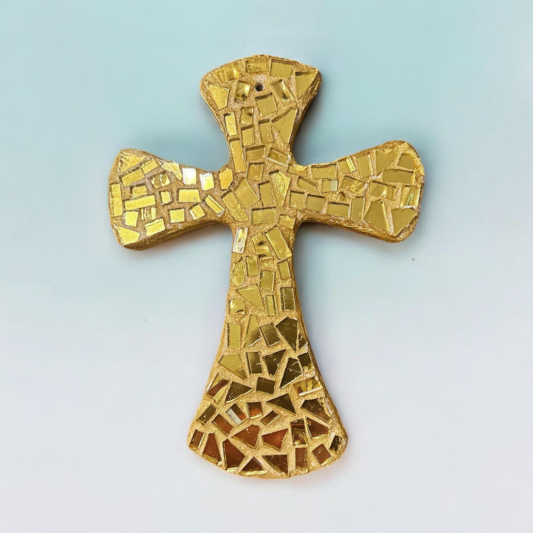 Handcrafted gold mosaic cross with intricate patterns, created by Miss Bette's Creations, detailed close-up view.