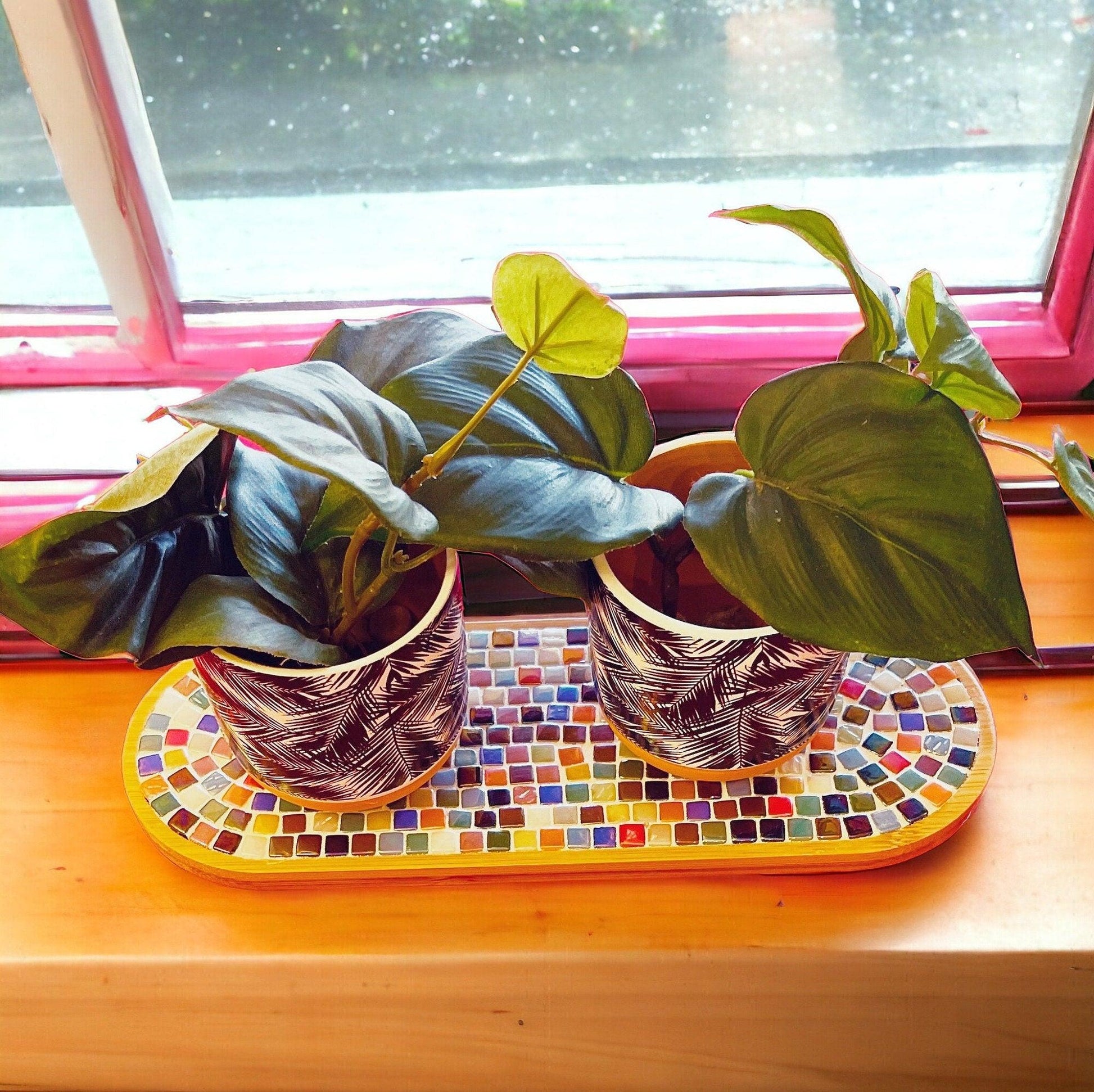Ceramic trivet, spoon rest, and plant stand with decorative design, ideal for kitchen or home decor.