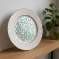 Multicolored rainbow mosaic fruit plate featuring vibrant, intricate tile designs on a decorative ceramic dish.