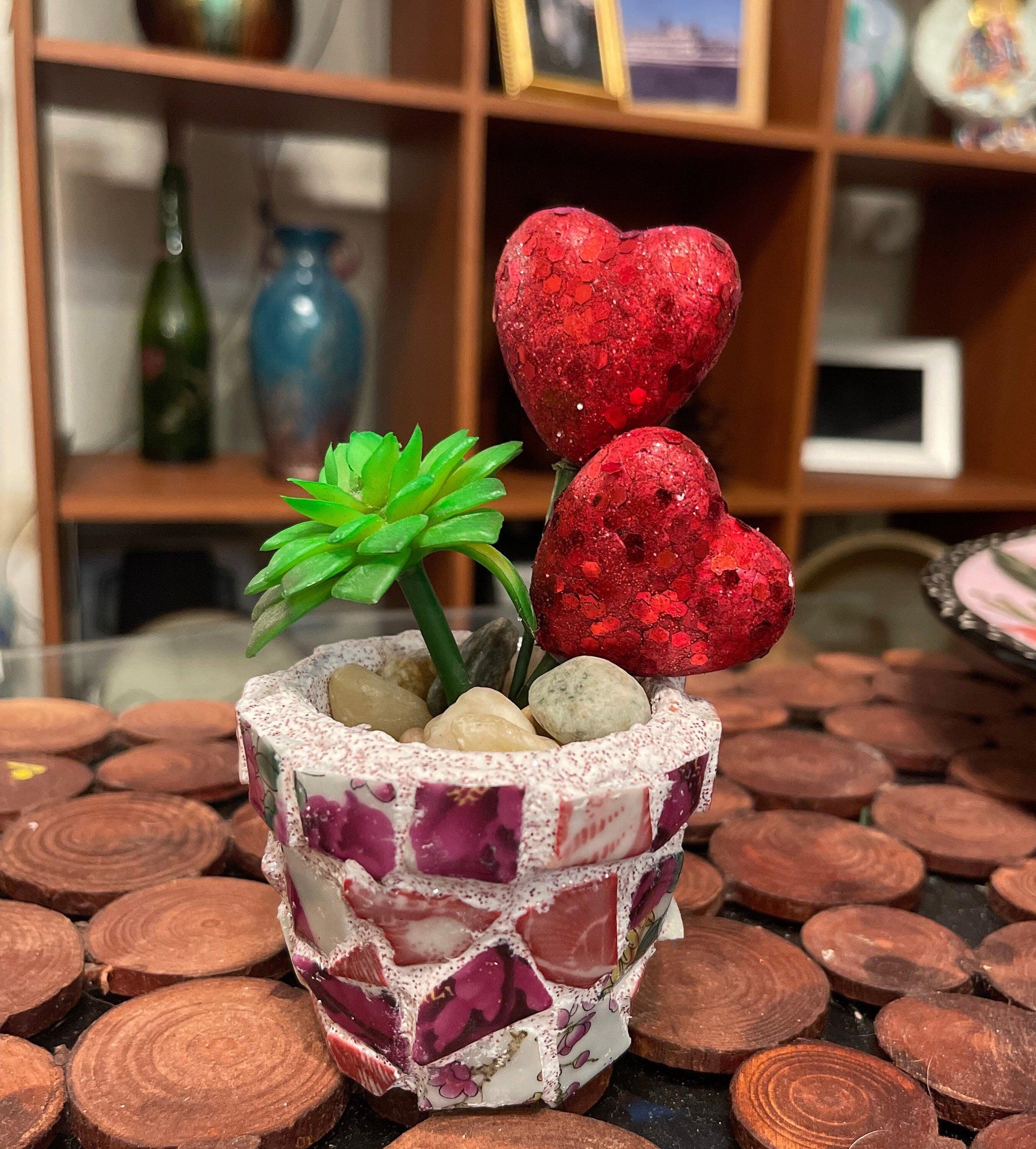 Handcrafted broken china heart mosaic planter with colorful mosaic tiles, designed for decorative indoor or outdoor use.