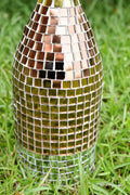 Luxury gold mosaic wine decanter with intricate gold and glass design, perfect for elegant wine serving.