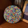 Handmade 7-inch rainbow mosaic plant stand with colorful tile pattern, designed to hold small potted plants.