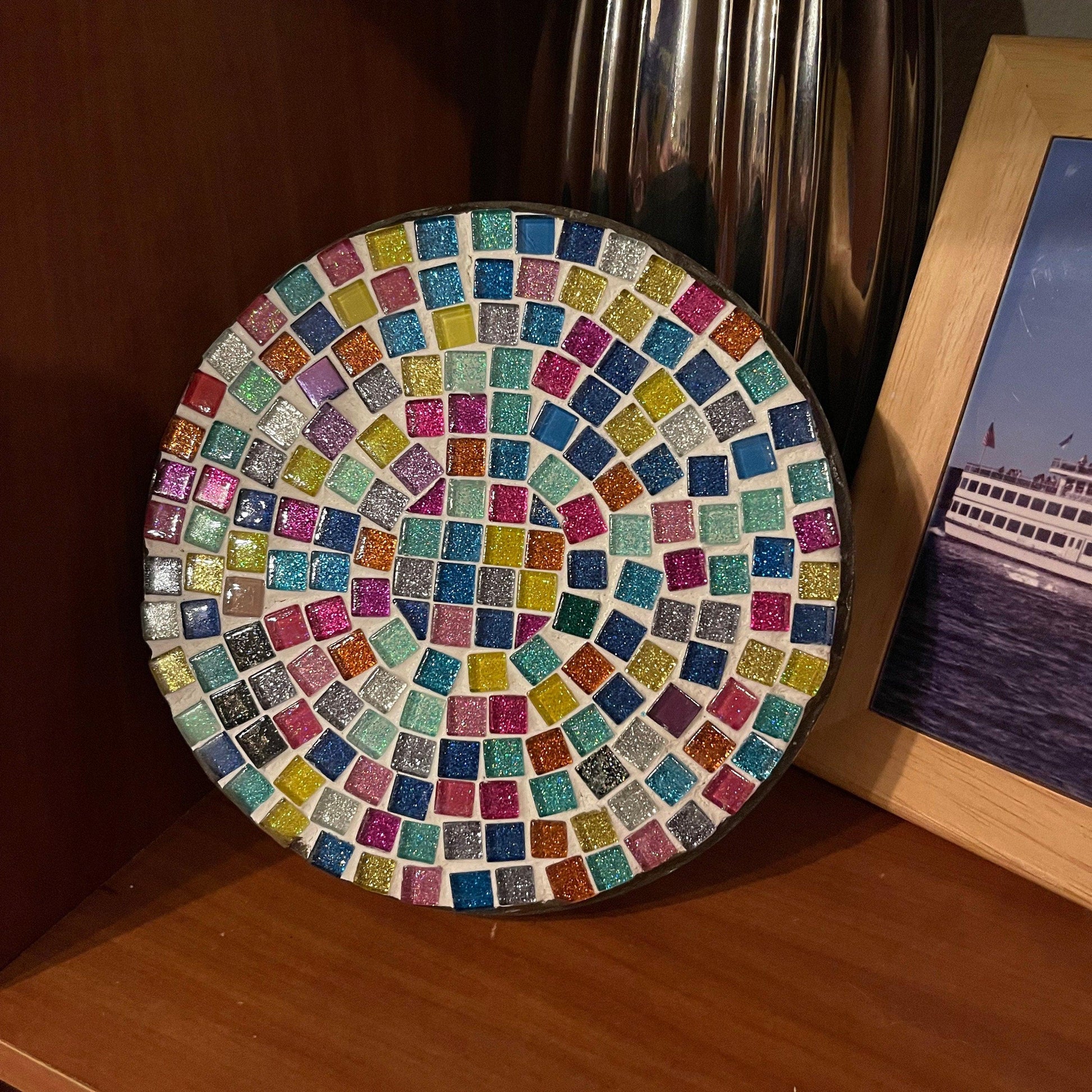 Handmade 7-inch rainbow mosaic plant stand with colorful tile pattern, designed to hold small potted plants.