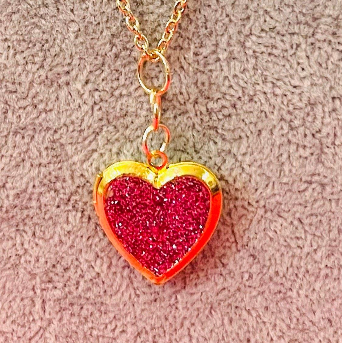 Gold sparkling rose heart-shaped locket with intricate detailing, perfect for sentimental jewelry lovers.