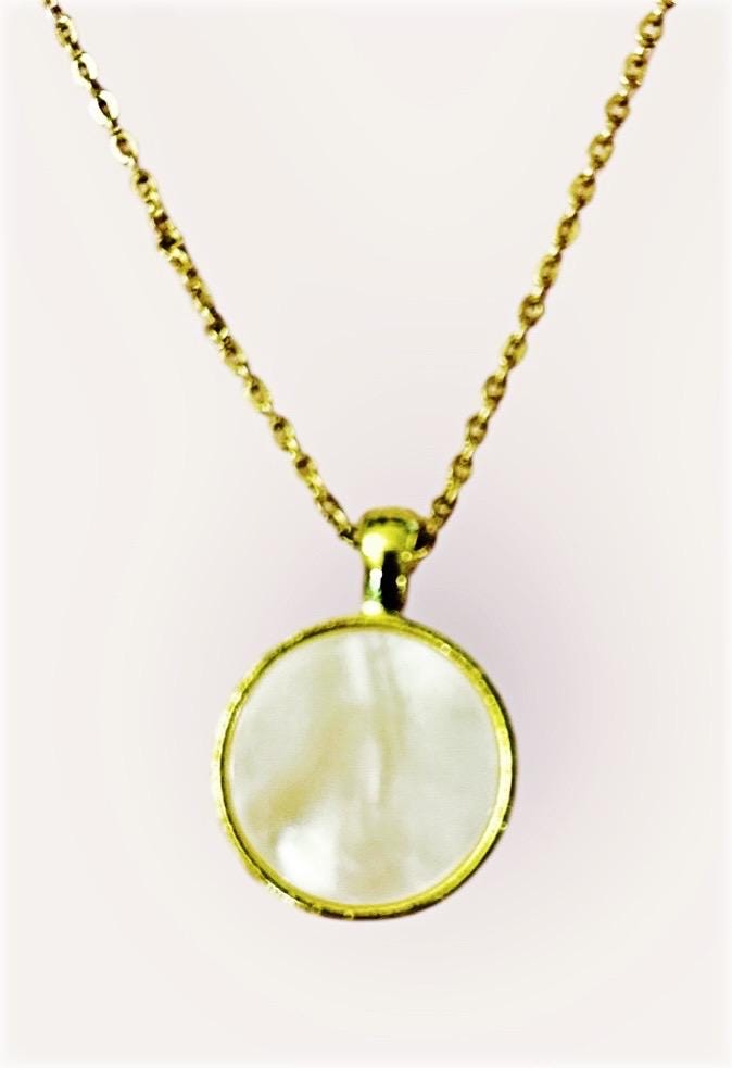 White mother of pearl round pendant necklace with silver chain, showcasing elegant jewelry design and smooth polished surface.