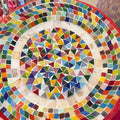 Colorful handcrafted mosaic fruit bowl with vibrant fruit patterns, made by My Store, displayed on a wooden table.
