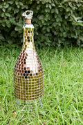 Luxury gold mosaic wine decanter with intricate gold pattern and clear glass body for elegant wine serving.