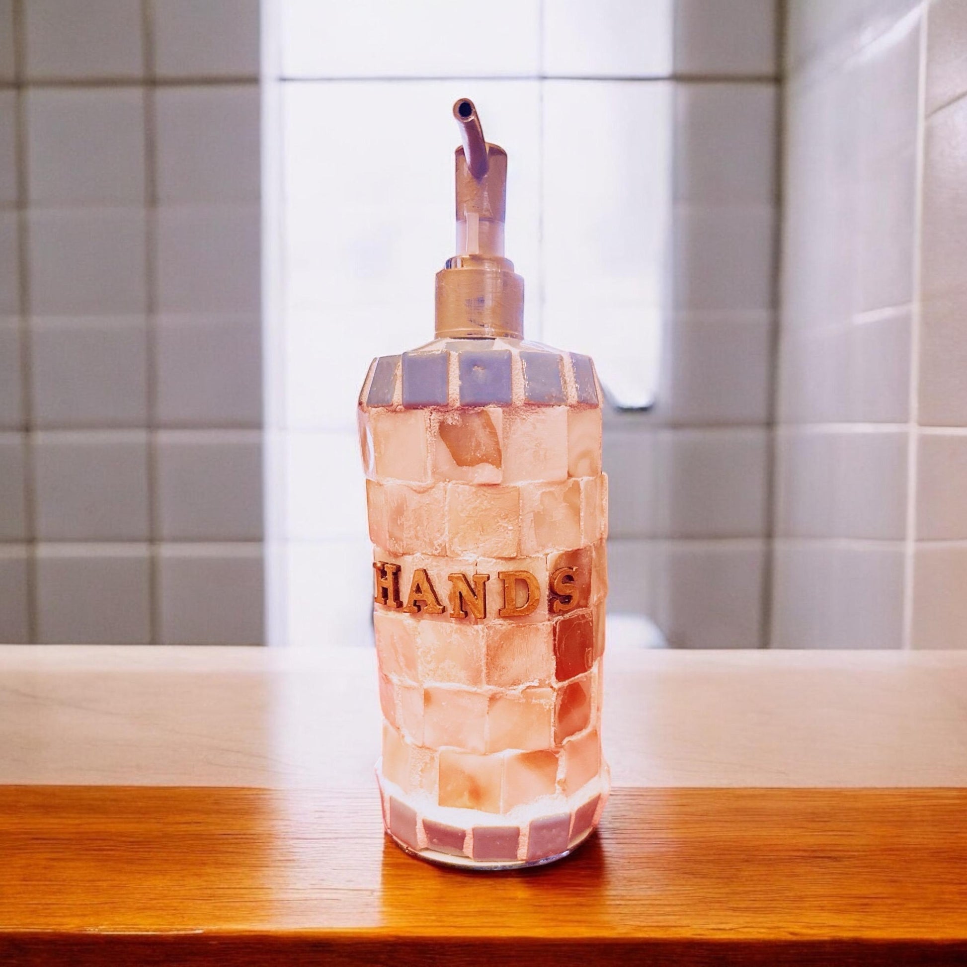 Handcrafted mosaic soap and lotion dispenser set with colorful tiled designs, durable ceramic material, and elegant craftsmanship.