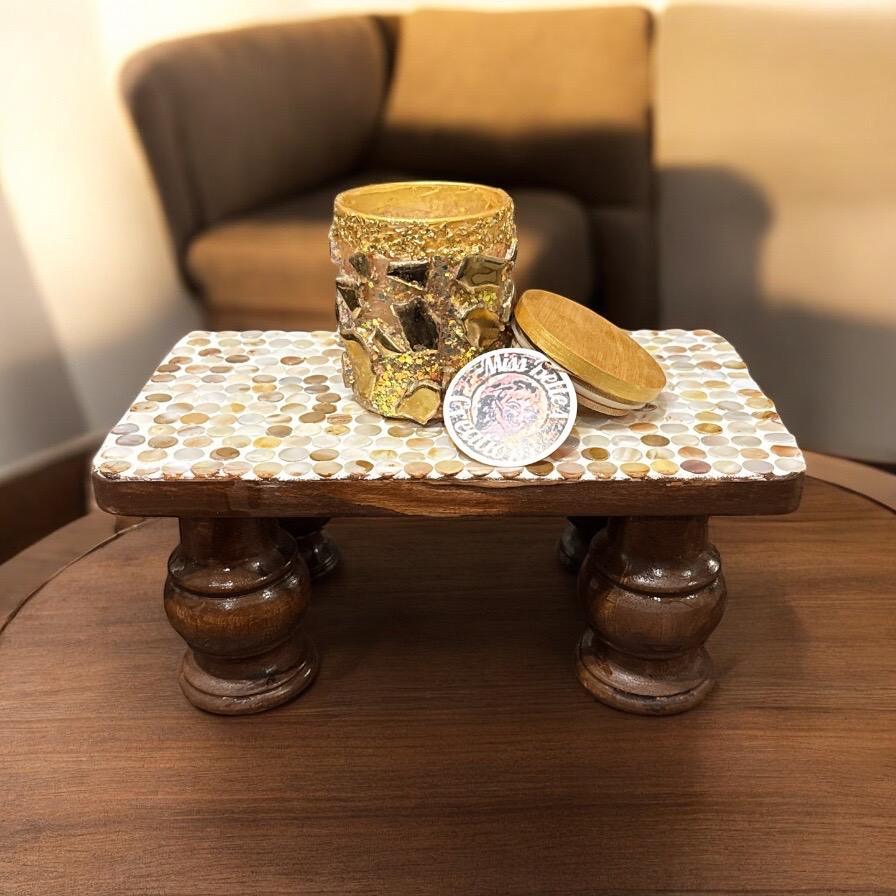 Vintage hand-carved wooden pedestal stand with intricate detailing, ideal for displaying decorative items or artwork.