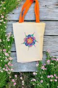 Handmade sparkling starburst diamond art canvas tote bag with colorful geometric design and sturdy fabric handles.